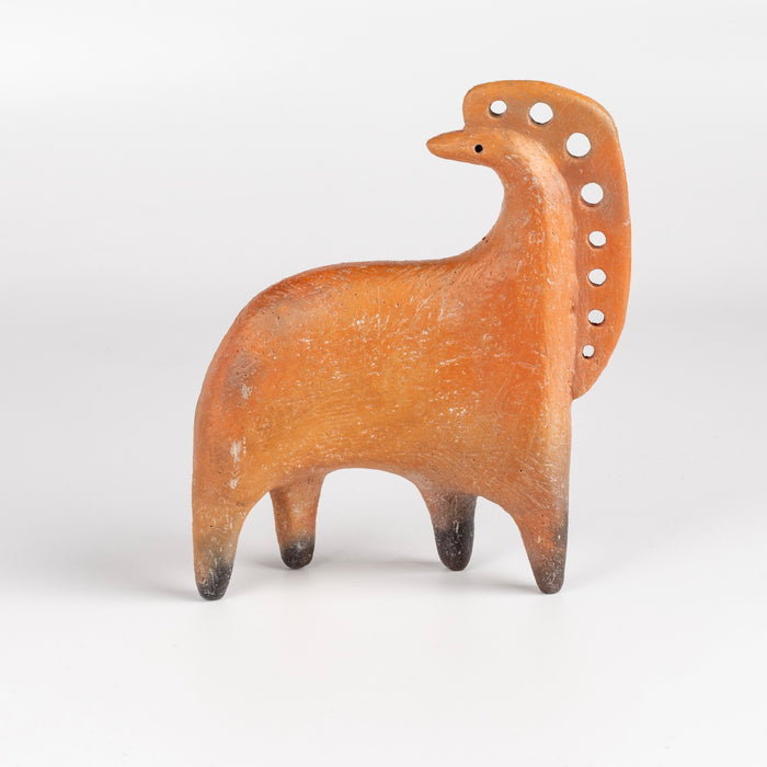 Formed from solid clay and refined by hand, this "one of a kind" ceramic creature is made out of red earthenware and red terra sigillata before getting pit fired in the wilderness. Made by Carol Horst in Los Angeles.