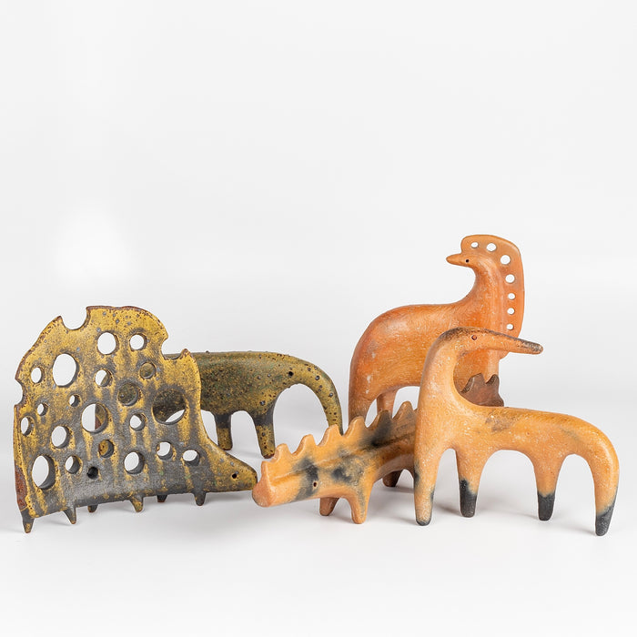 A mix of "one of a kind" ceramic creatures  in  red earthenware and red terra sigillata as well as in glazed stoneware made by Carol Horst in Los Angeles.