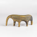A yellow ceramic creature is ofrmed from solid clay and refined by hand, this "one of a kind" ceramic creature is made out of stoneware and glazed before getting reduction fired. Made by Carol Horst in Los Angeles.