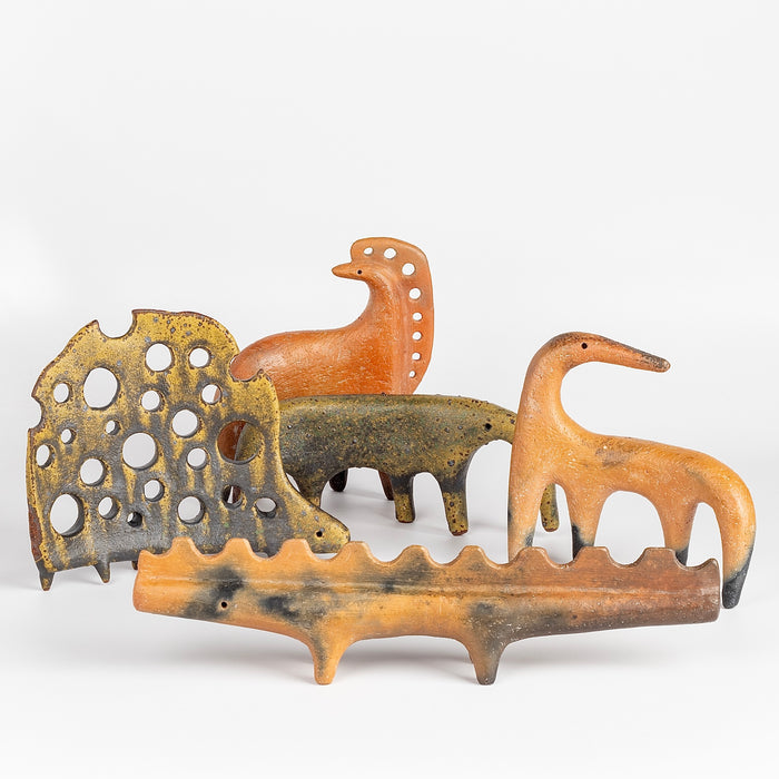 A mix of "one of a kind" ceramic creatures  in  red earthenware and red terra sigillata as well as in glazed stoneware made by Carol Horst in Los Angeles.