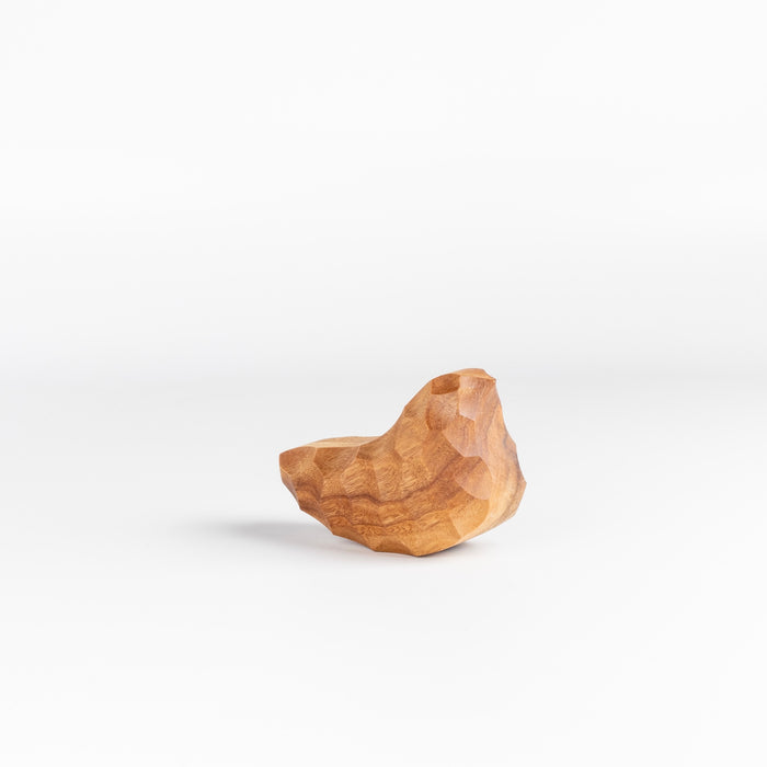 Medium Carved Wood Bird "Chicchi" from Akihiro Woodworks is a hand carved bird in tabunoki wood that will sway back and forth when you push on it. Each bird is unique and may vary in color and the appearance of knots in the wood. Made by Akihiro Woodworks in Kagoshima, Japan.