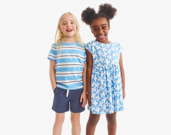 Child wearing Primary Chino Drawstring Shorts - Sunwashed Navy. Available at www.tenlittle.com