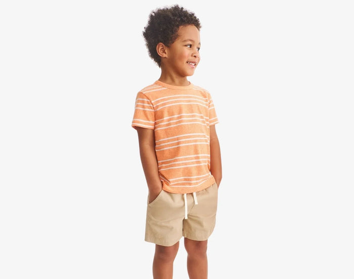 Child wearing Primary Chino Drawstring Shorts - Khaki. Available at www.tenlittle.com
