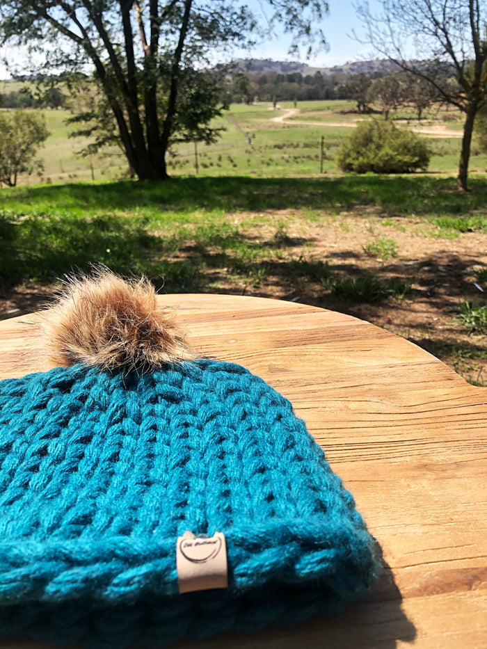 adult size (one size fits most) / Rich teal / fluffy pom pom