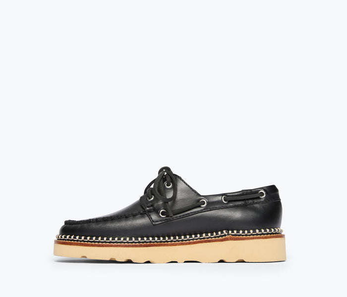 Black calf leather Collins Loafer by Freda Salvador, showing the inside view with detailed stitching and smooth leather finish.