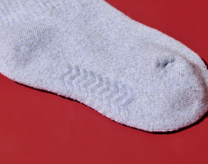 Close-up view of non-skid, BPA-free grips on Ten Little Cozy Socks. Available at www.tenlittle.com