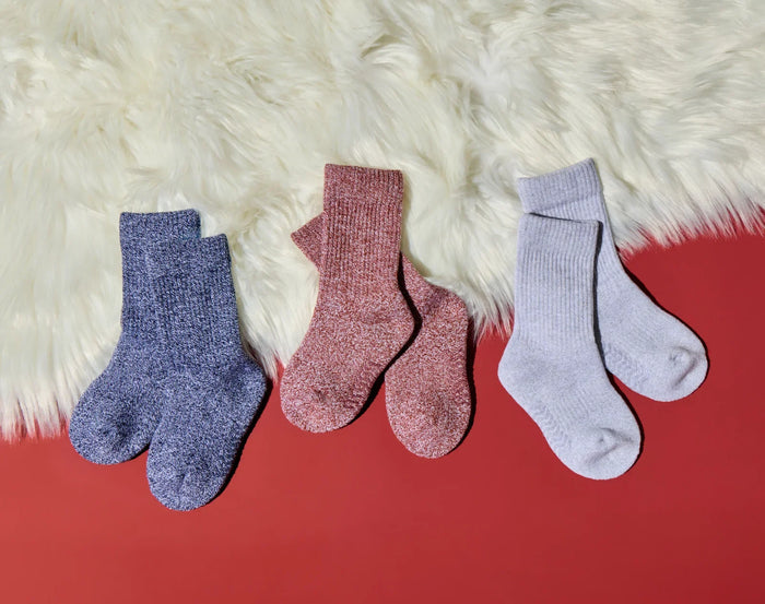 Side view of Ten Little Cozy Socks on furry background - Assorted Color Pack - Navy, Gray, Rust. Available at www.tenlittle.com
