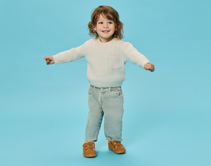 Child wearing Ten Little Cozy Suede Sneakers - Toffee Brown. Available at www.tenlittle.com