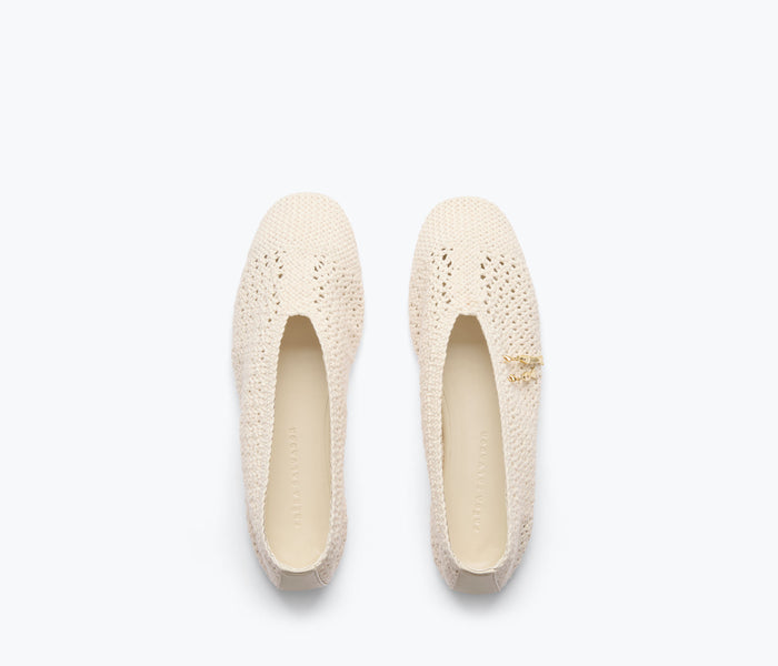 Freda Salvador Daisy Crochet Flat with vanilla-colored woven upper and flat sole, showcasing intricate crochet detailing.