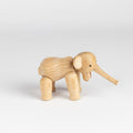 Lilliput wood elephant designed by Kay Bojesen in 1953 is the smallest version of the elephant available in untreated oak.