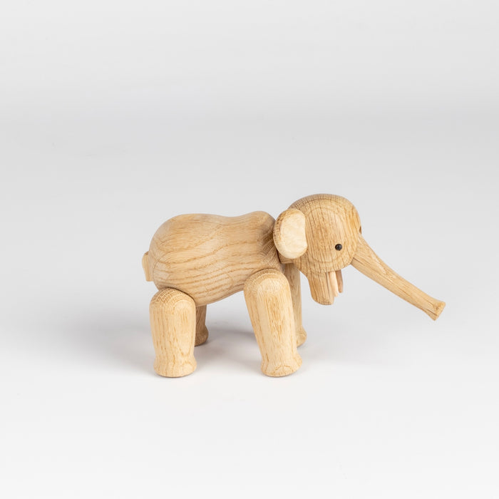 Lilliput wood elephant designed by Kay Bojesen in 1953 is the smallest version of the elephant available in untreated oak.