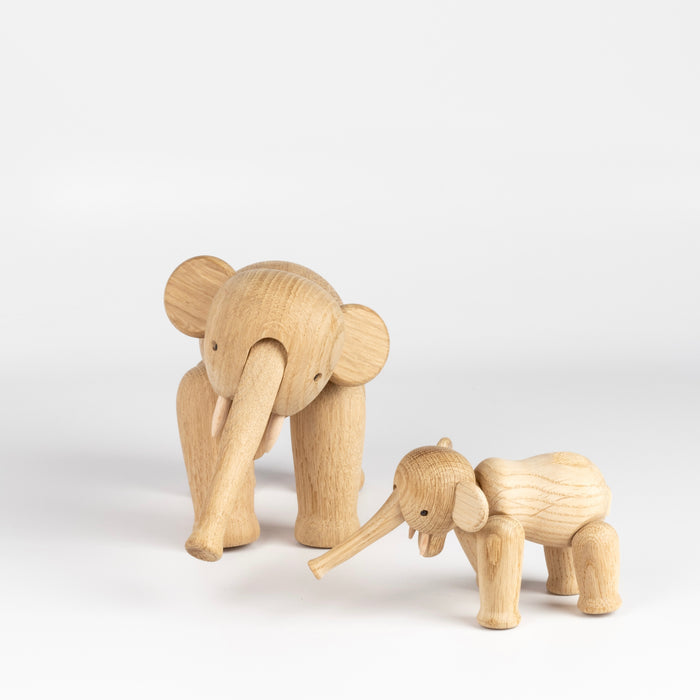 Small and Lilliput (mini) wood elephants designed by Kay Bojesen.