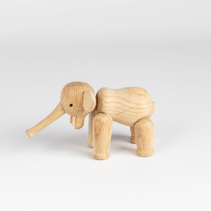 Another side of the unreated oak Lilliput elephant toy or sculpture.