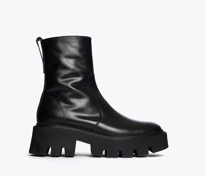 Freda Salvador Darla black Chelsea boot with lug sole, front view showing sleek leather design and sturdy outsole.