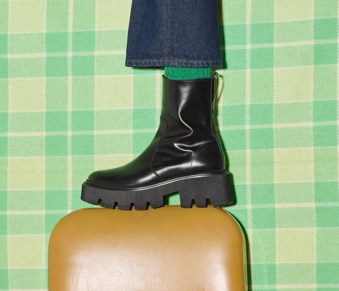 Black FREDA SALVADOR Darla Lug Sole Chelsea Boot with chunky sole and sleek leather finish.