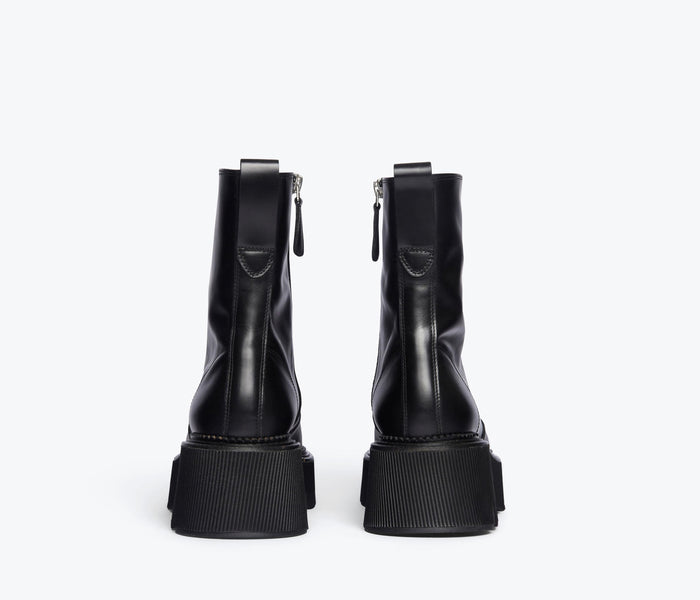 Black FREDA SALVADOR Darla Lug Sole Chelsea Boot with a sleek silhouette and chunky sole, stylish and versatile for everyday wear.