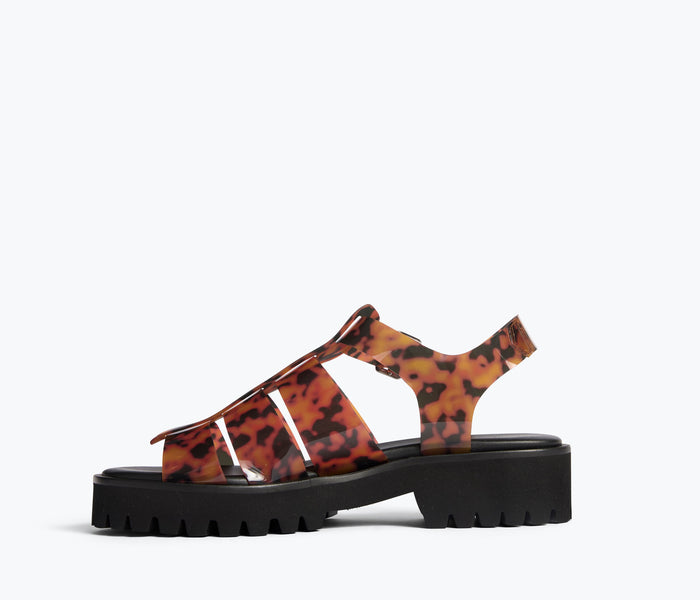 Freda Salvador Darya Lug Sole Fisherman sandal in turquoise PVC with inside view showing sandal's strap and sole details.