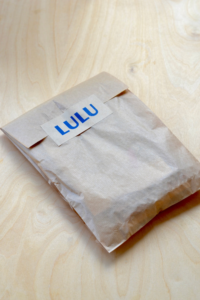 Assorted Dosa Napkins in a set of four(4) in paper bag with Lulu sticker.