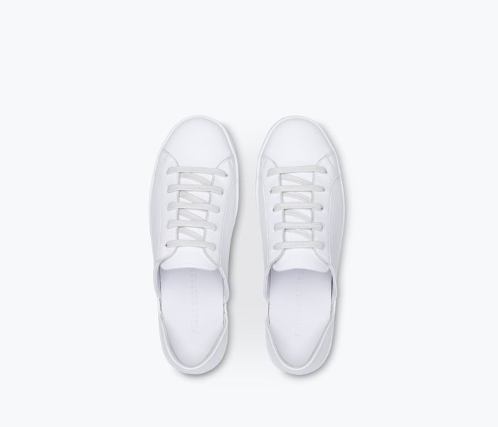 Freda Salvador EDA D'Orsay sneaker with white leather upper, sleek design, and stylish low-top silhouette.