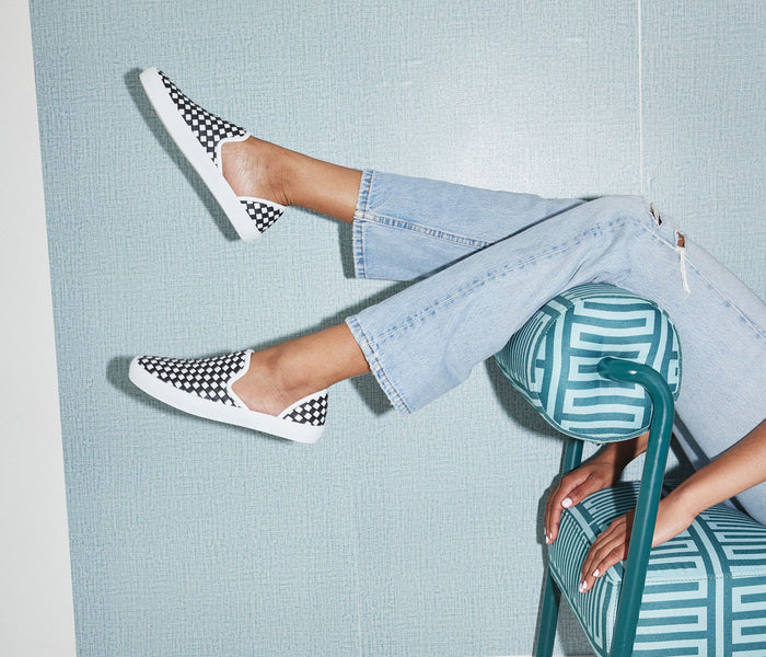 FREDA SALVADOR Eddy D'Orsay sneaker in black and white with sleek design and lace-up closure.