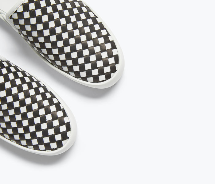 Black and white FREDA SALVADOR Eddy D'Orsay sneaker with detailed stitching and stylish design.