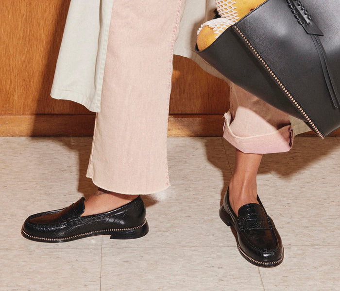 Freda Salvador Elba Penny Loafer in black leather, featuring classic slip-on style and sleek design with a low heel.