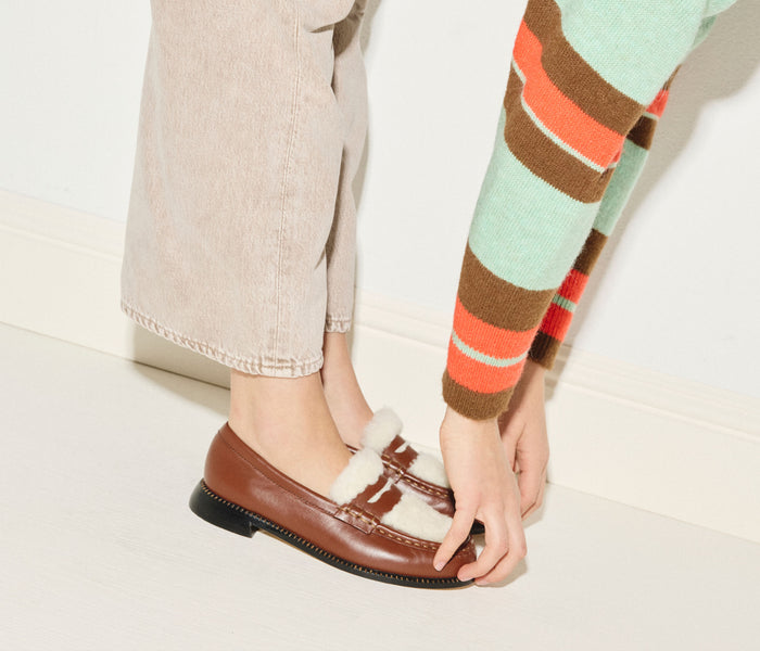 FREDA SALVADOR ELBA Penny Loafer in cognac leather with sherling lining, showcasing classic slip-on style and craftsmanship.