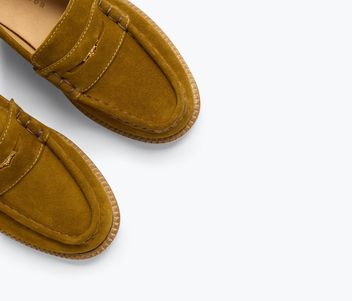 Freda Salvador Elba Penny Loafer in suede, featuring classic slip-on design with detailed stitching and a sleek silhouette.
