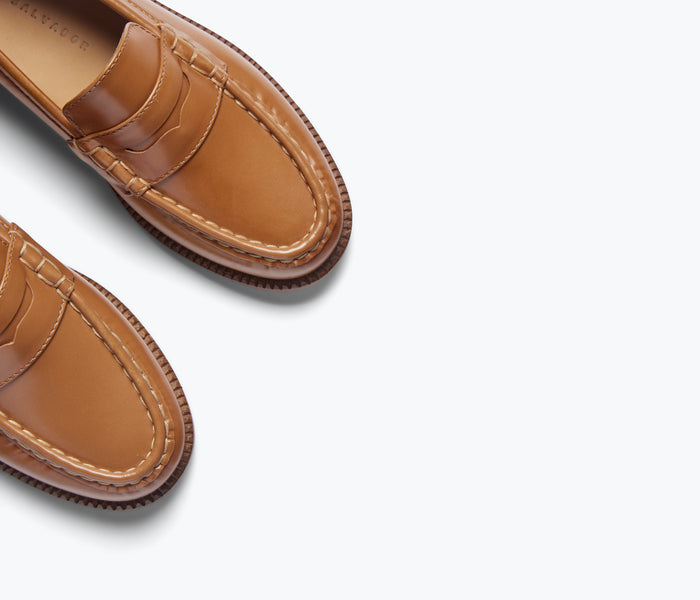 Freda Salvador Elba Penny Loafer in brown leather with detailed stitching and classic slip-on design.