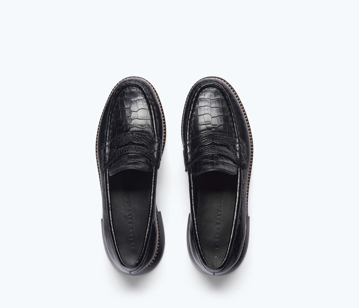 Black croc-embossed ELBA Penny Loafer by FREDA SALVADOR with classic slip-on design and rounded toe.