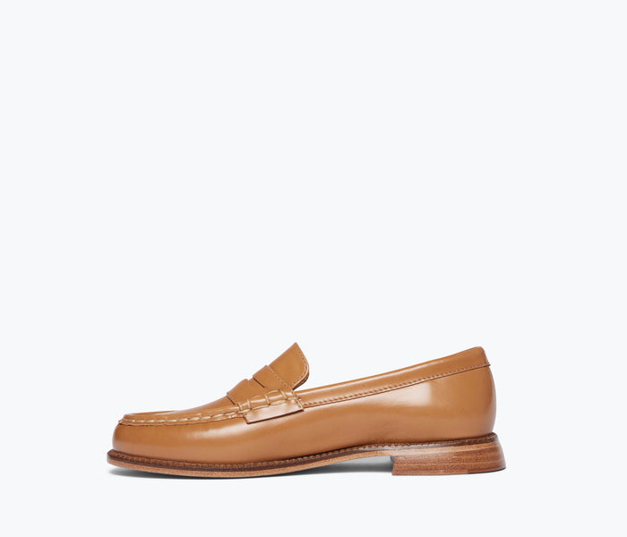 Freda Salvador Elba Penny Loafer in brown leather, showing the inside view with stitching and classic loafer design.