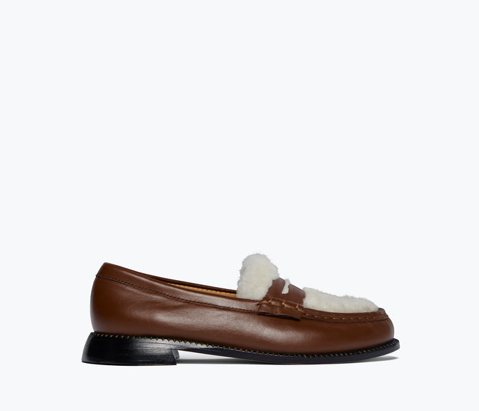 FREDA SALVADOR ELBA Penny Loafer in cognac leather with sherling lining, front view showing classic loafer design.