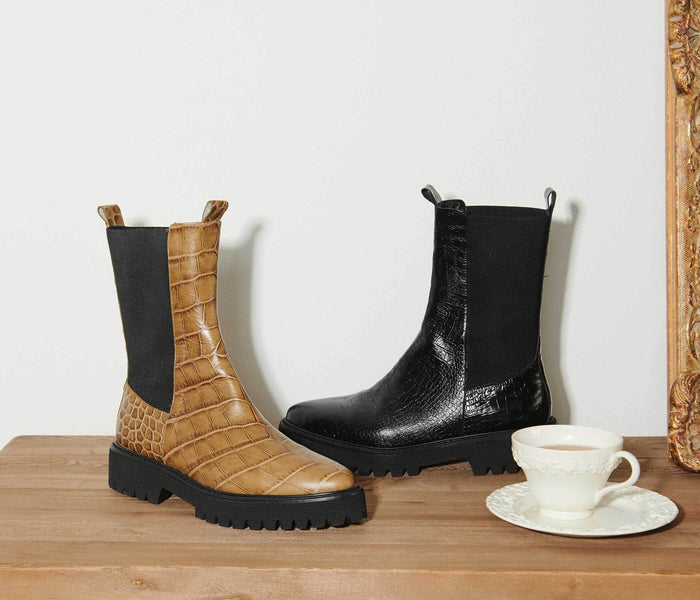 Freda Salvador ELI mid-calf boot in black leather with a sleek silhouette and ankle-high design.