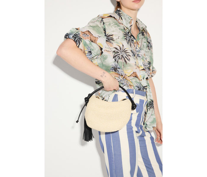 Freda Salvador Elis Mini Crescent Bag made of natural raffia with a compact, stylish design and curved crescent shape.