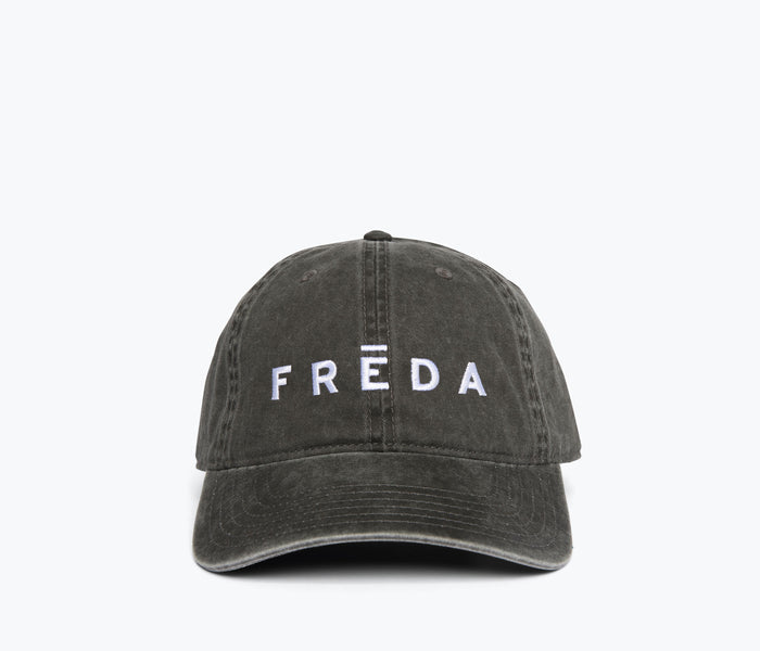 Black embroidered Freda hat by OTTO featuring detailed stitching and a stylish, casual design.