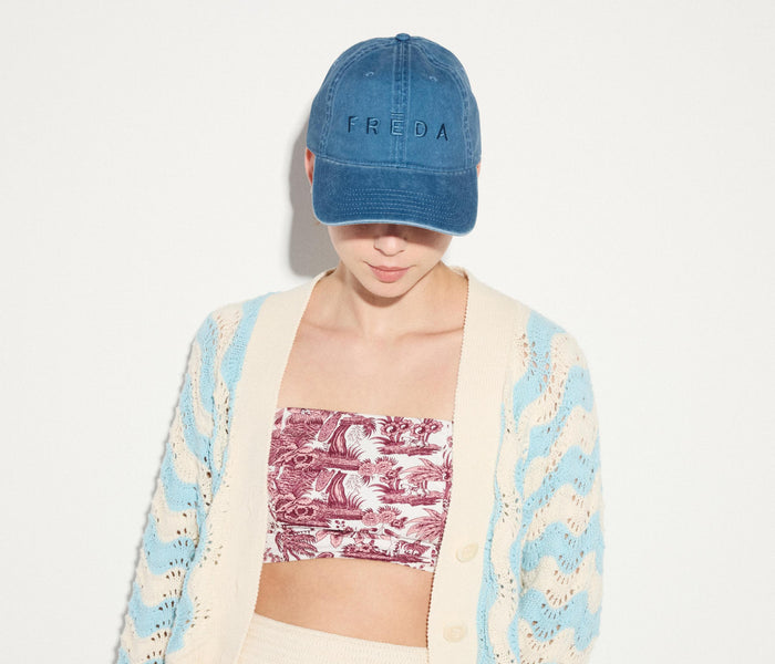 Blue embroidered Freda hat from OTTO, stylish apparel accessory with detailed stitching and casual fit.