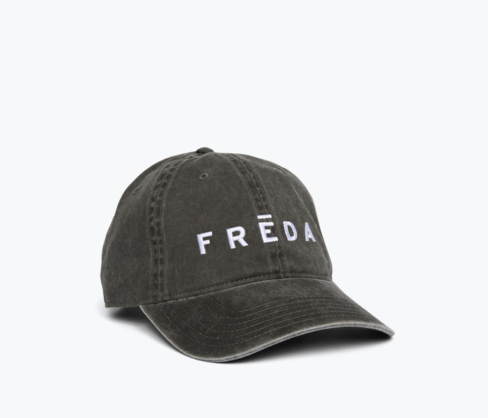 Black embroidered Freda hat by OTTO featuring detailed stitching and a stylish side view.