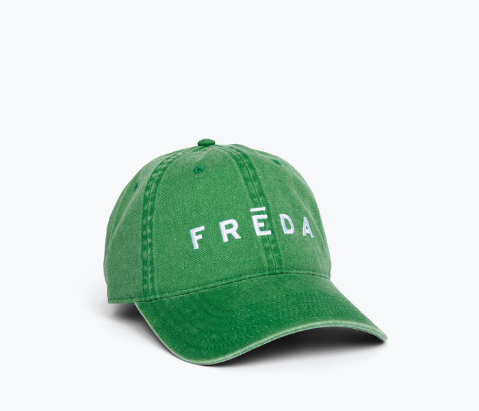 Side view of OTTOCAP embroidered Freda hat in green, a stylish accessories piece with detailed embroidery.