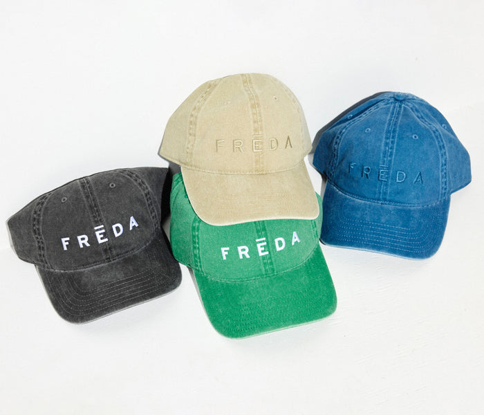 Blue embroidered Freda hat from OTTO, stylish apparel accessory with detailed stitching and casual fit.