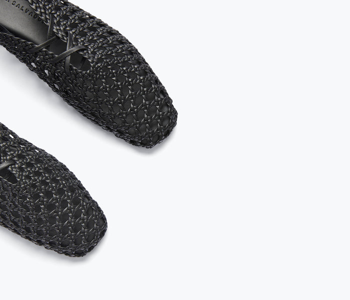 Black woven calf leather ETTA ankle lace-up mule by Freda Salvador with detailed strap and flat sole.