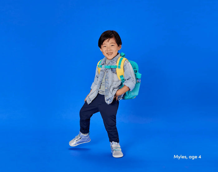 Child age 4 wearing Ten Little Everyday High Tops - Moondust Silver. Available at www.tenlittle.com