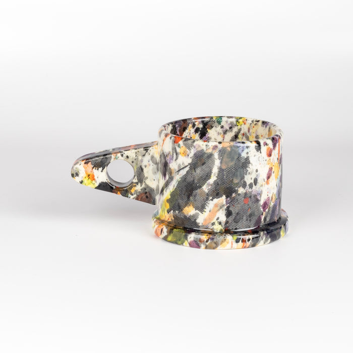 Other side of EXP Standard Splatter Mug in Black, Red, Orange and Purple.