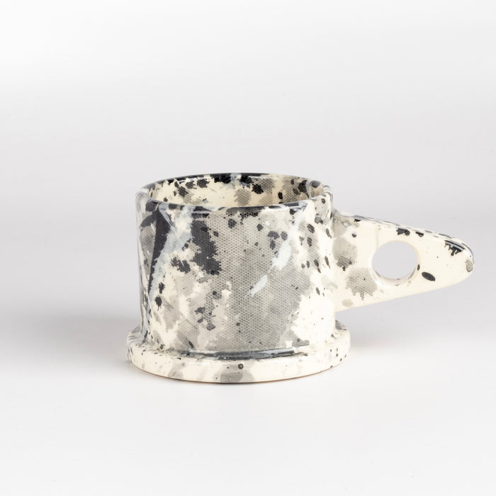 EXP standard splatter mugs by Peter Shire and Echo Park Pottry in black, white and gray.