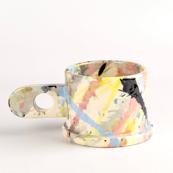 Other side of EXP Standard Splatter Mug in Pastels and Black.
