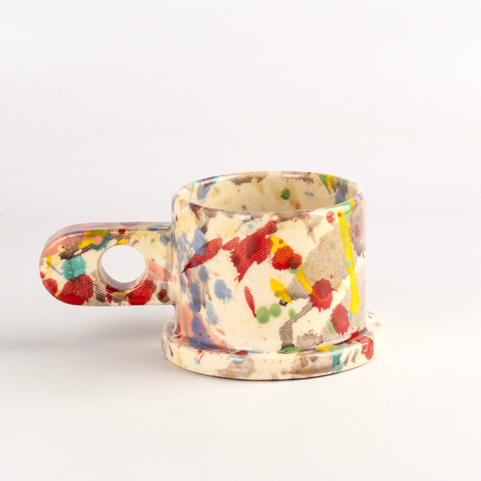 Alternate side of EXP Standard Splatter Mug in Pink with Yellow and Turquoise Stripes by cho Park Pottery and Peter Shire.