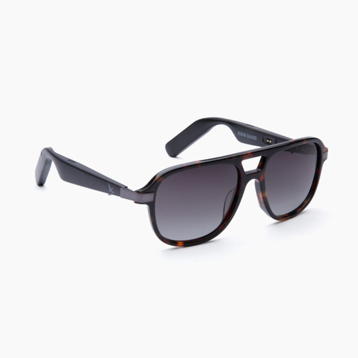 Tortoiseshell sunglasses with dark gradient lenses and thick frames, offering polarized UV400 protection. Displayed on a white background, the arms are slightly curved with "Eddie Bauer Explorer" printed on the inner side of one arm.
