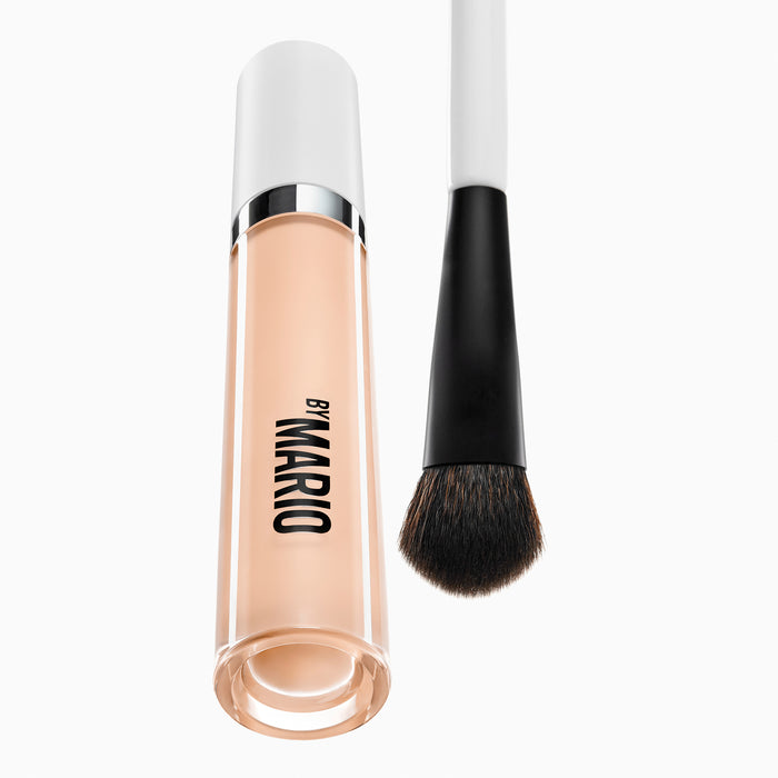A image of Makeup By Mario's F5 Concealer Brush and a SurrealSkin™ Awakening Concealer bottle.