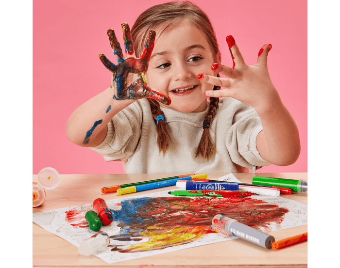 Child painting with Djeco Finger Paint Tubes - Set of 6. Available at www.tenlittle.com