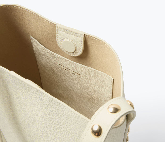Freda Salvador Fiona Small Studded Tote bag in bone calf leather with silver stud accents and top handles.