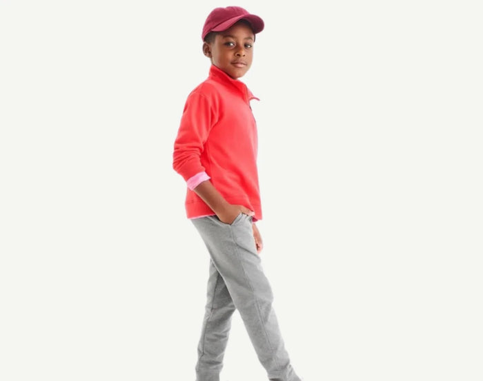 Boy wearing Primary French Terry Quarter Zip Sweatshirt - Strawberry. Available at www.tenlittle.com